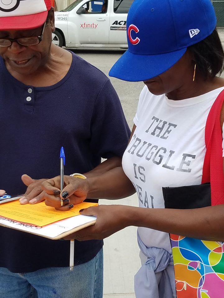 a woman filling out a form on a clipboard