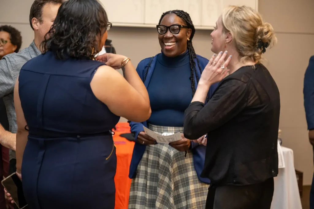 Group Laughing At Fundraiser