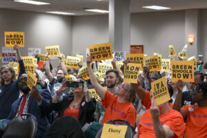 green schools now crowd with signs