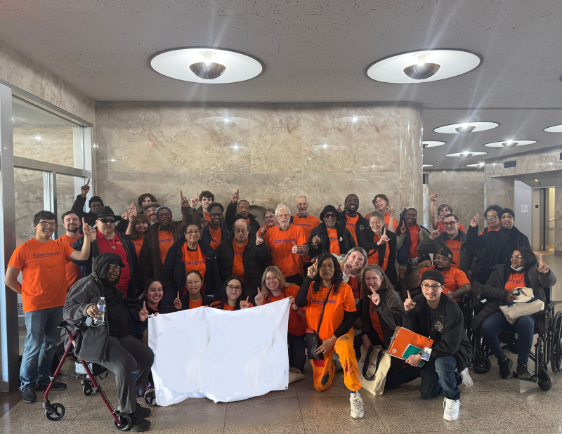 large group in orange shirts