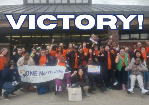 big crowd with victory written above