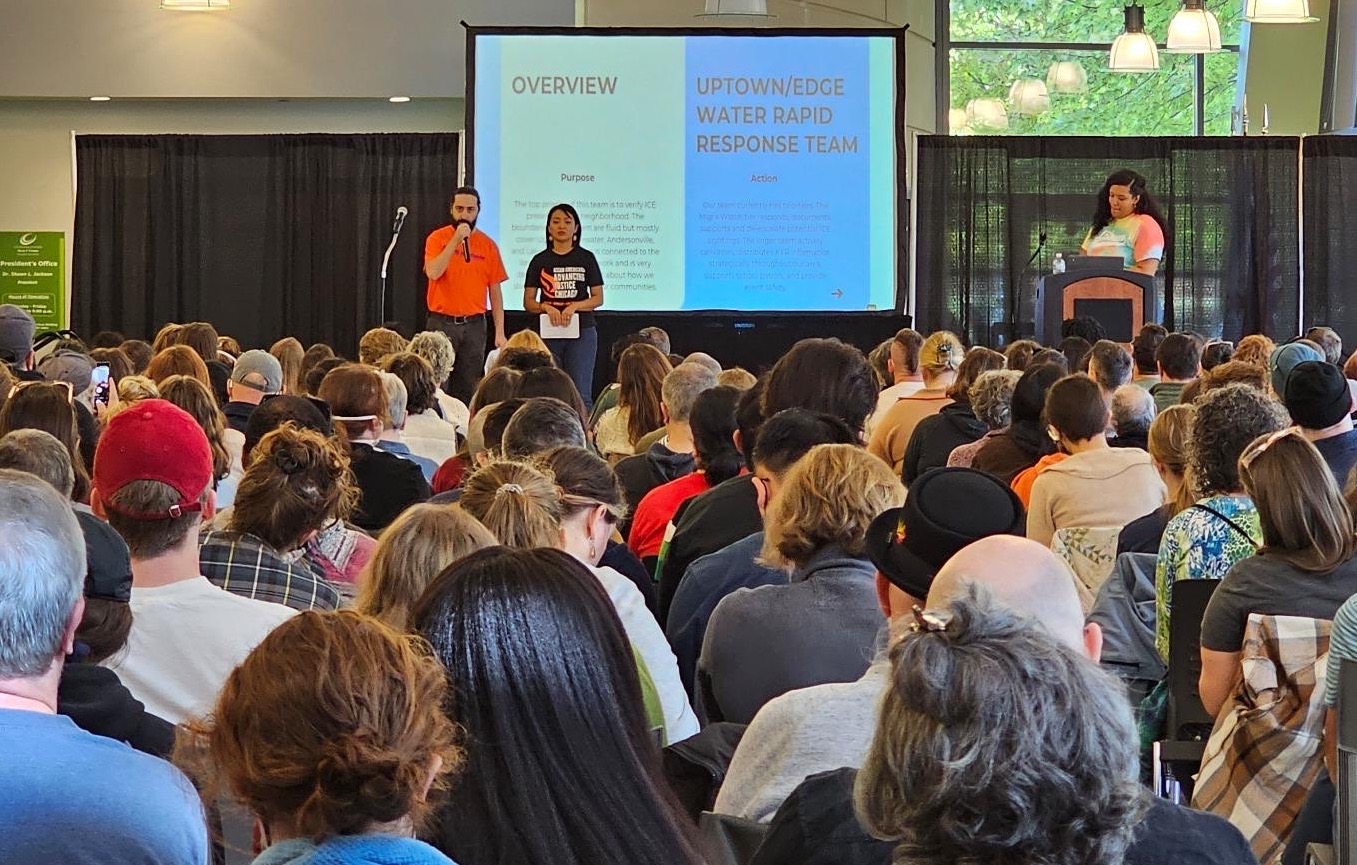 group in large room watching presentation