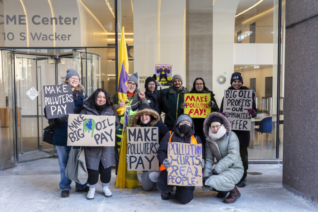 a group of make polluters pay protestors